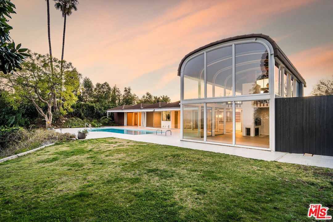 11271 Chalon Road Los Angeles, CA 90049 - Photo 30 of 35 a house view with a garden space