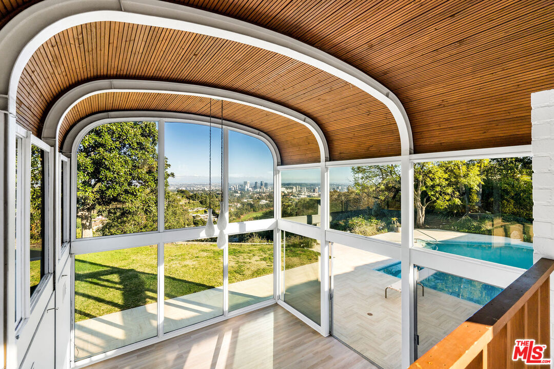 11271 Chalon Road Los Angeles, CA 90049 - Photo 9 of 35 a view of living room with balcony