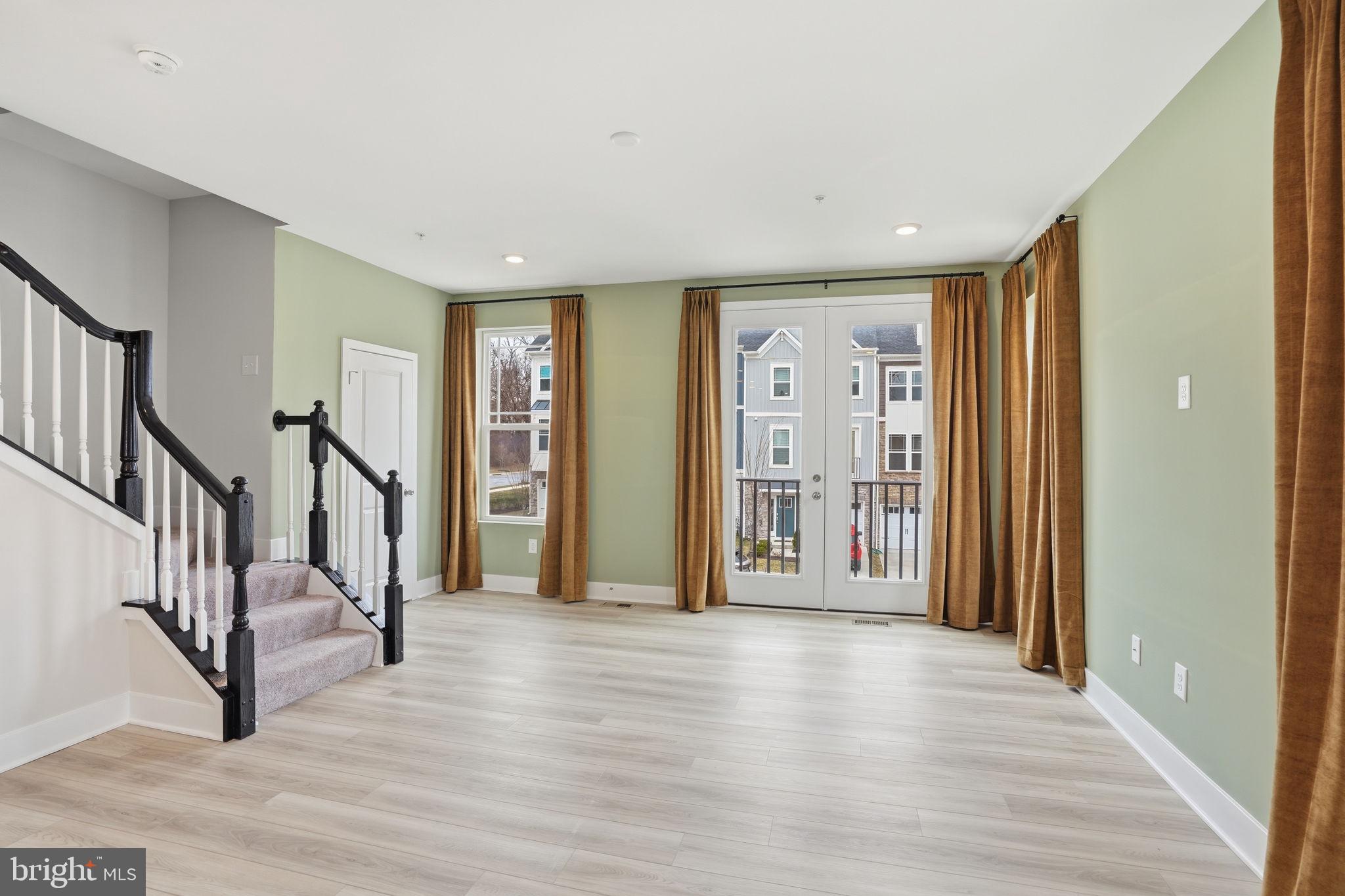 1810 Betterton Road Essex, MD 21221 - Photo 12 of 34 a view of an entryway with wooden floor and stairs