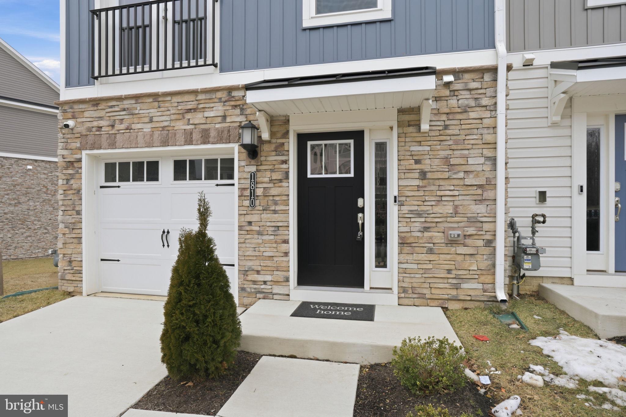 1810 Betterton Road Essex, MD 21221 - Photo 2 of 34 a view of a brick house with many windows