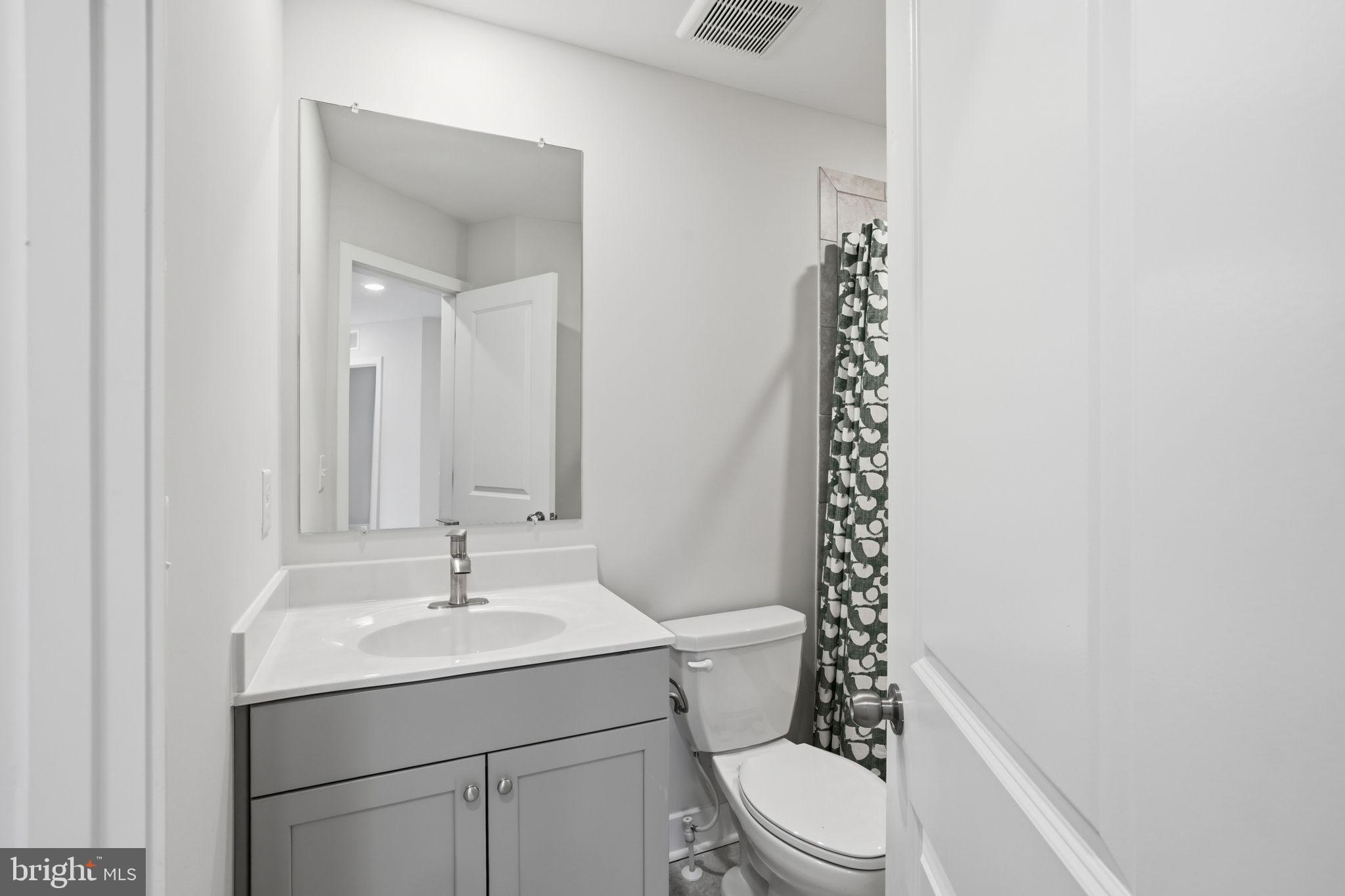 1810 Betterton Road Essex, MD 21221 - Photo 25 of 34 a bathroom with a sink toilet and shower