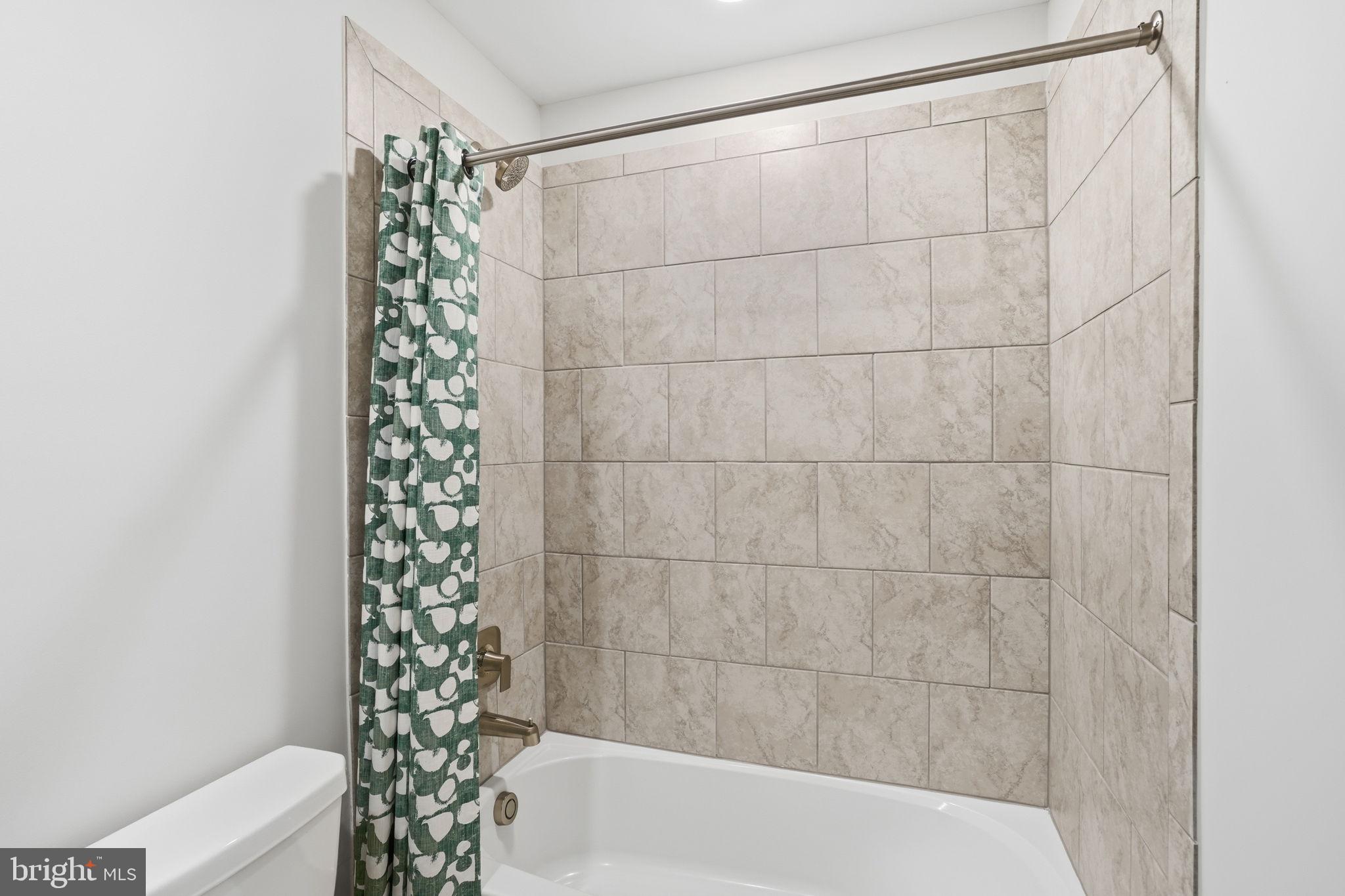 1810 Betterton Road Essex, MD 21221 - Photo 26 of 34 a bathroom with a bathtub and shower
