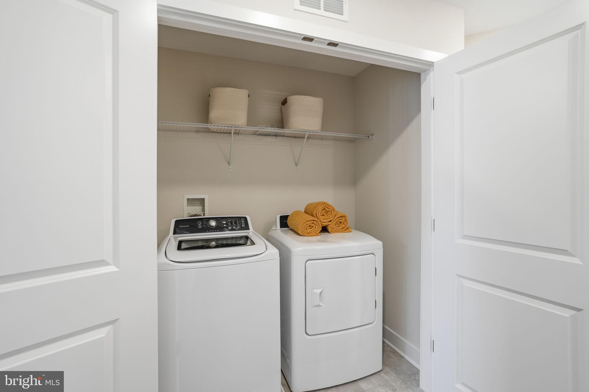 1810 Betterton Road Essex, MD 21221 - Photo 31 of 34 a view of storage and utility room with washer and dryer