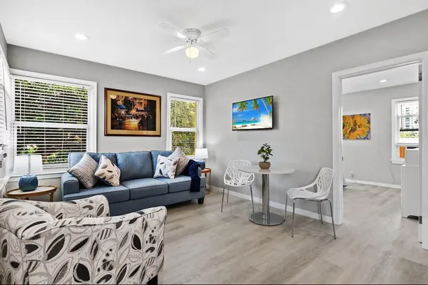 a living room with furniture and a window