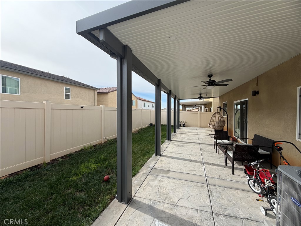 1316 Goldenbrush Way Banning, CA 92220 - Photo 7 of 17 a view of a porch with furniture and garden