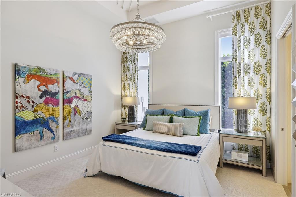 675 Anchor Rode Drive Naples, FL 34103 - Photo 14 of 19 a living room with furniture and a chandelier