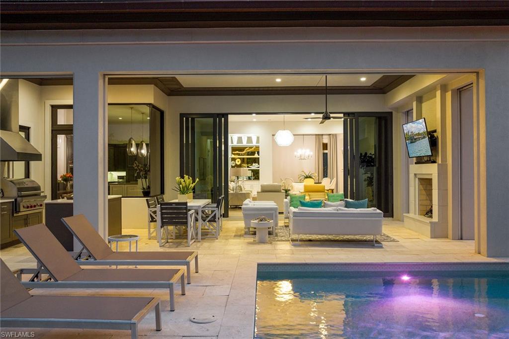 675 Anchor Rode Drive Naples, FL 34103 - Photo 18 of 19 a living room with furniture and a large window
