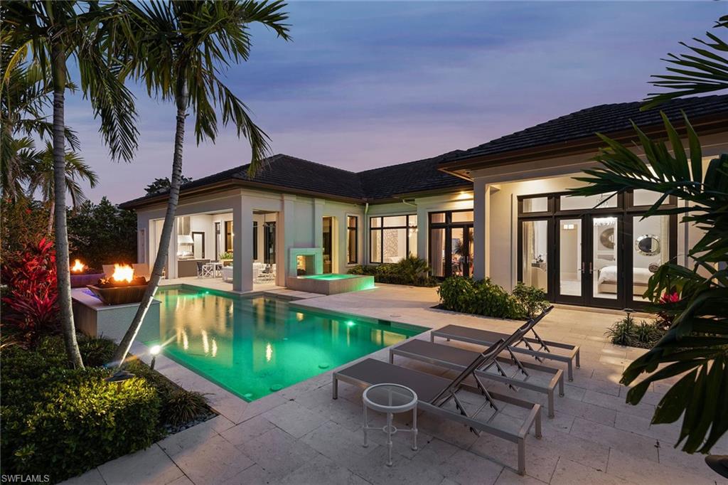 675 Anchor Rode Drive Naples, FL 34103 - Photo 3 of 19 a view of a house with swimming pool and sitting area