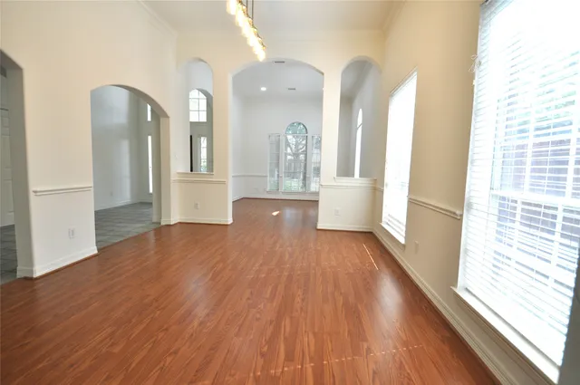 a view of a hallway view with wooden floor and staircase