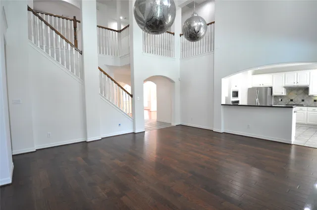 a view of an entryway with wooden floor