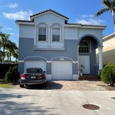 a car parked in front of a house