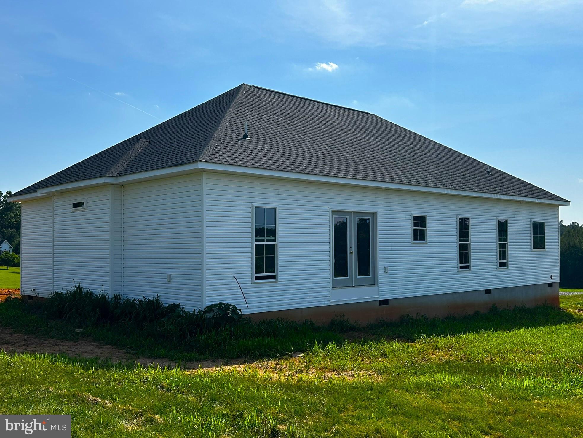7005 Canterberry Lane Rhoadesville, VA 22542 - Photo 2 of 2 a backyard of a house with lots of green space