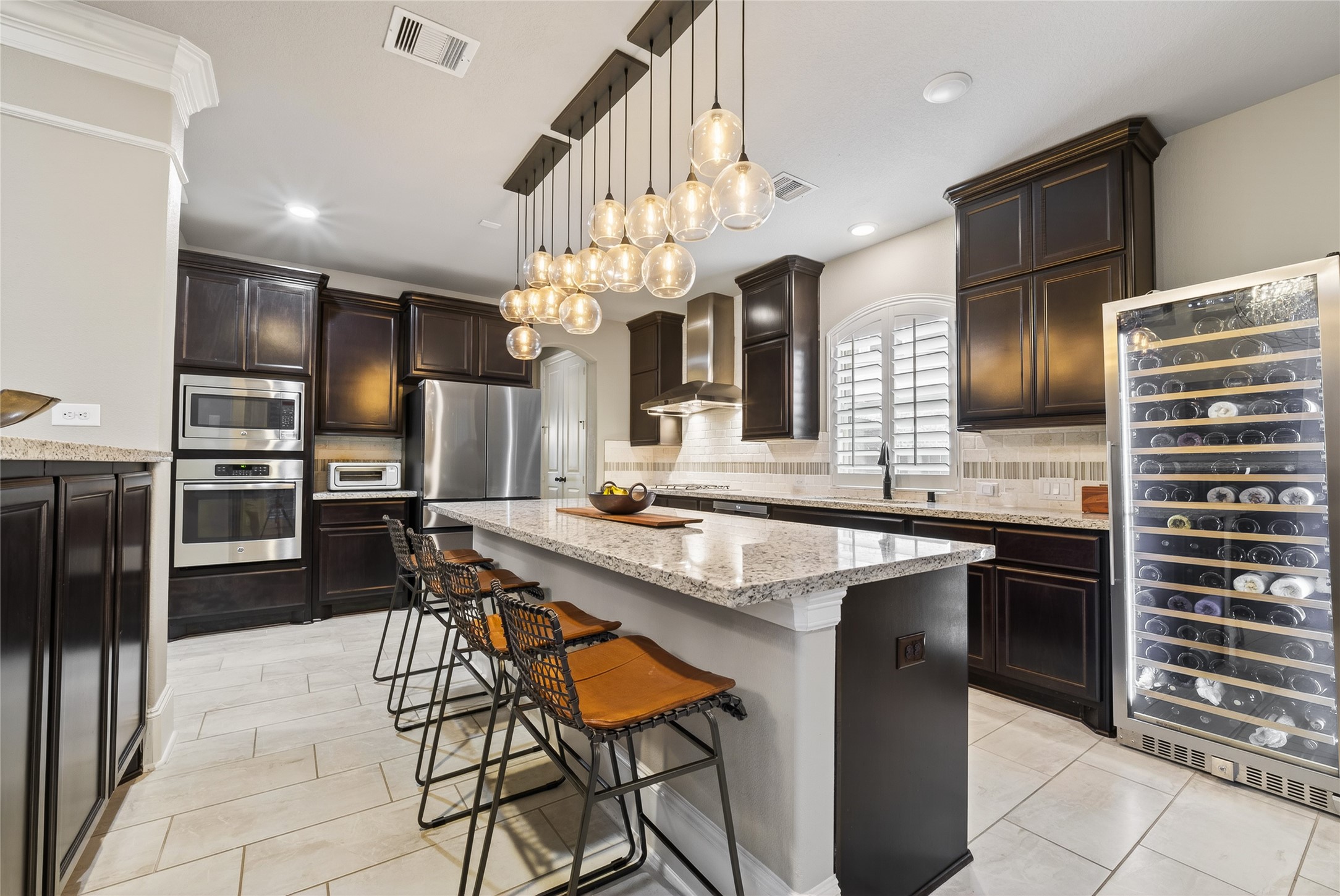 7907 Augusta Creek Court Spring, TX 77389 - Photo 16 of 49 The kitchen and family room flow effortlessly into each other allowing easy entertaining.