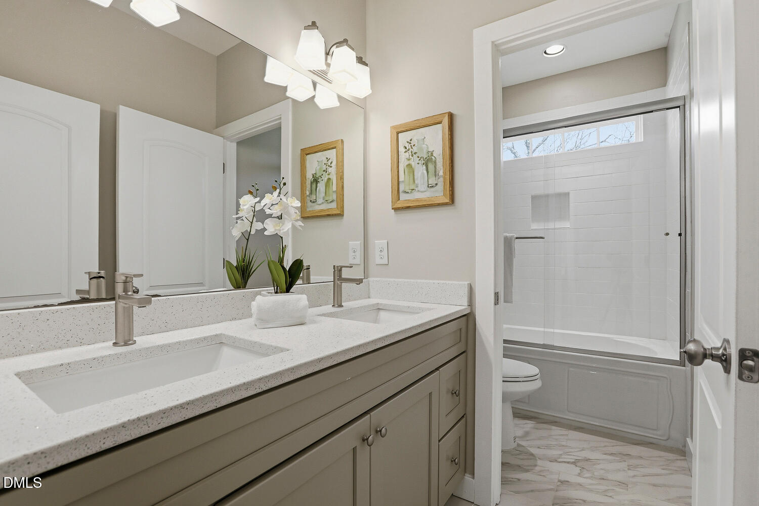 1605 Boyer Street Raleigh, NC 27610 - Photo 25 of 38 a bathroom with a sink a toilet and shower