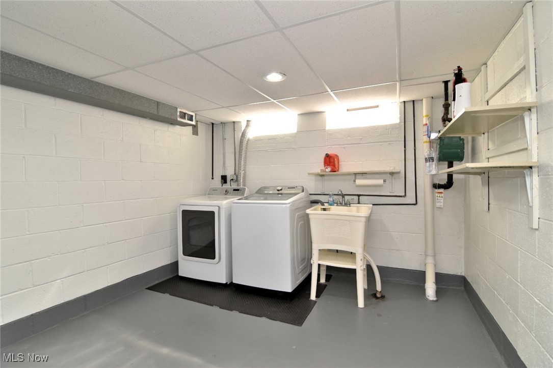 981 Hanley Road Cleveland, OH 44124 - Photo 37 of 42 Laundry area with a drop ceiling, concrete flooring, and independent washer and dryer