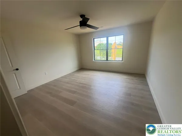 a view of an empty room with a window