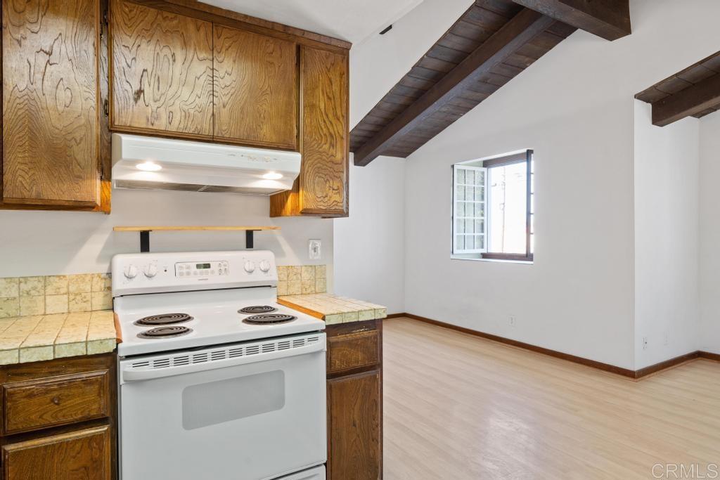 1048 Neptune Avenue Encinitas, CA 92024 - Photo 46 of 54 a stove top oven sitting inside of a kitchen