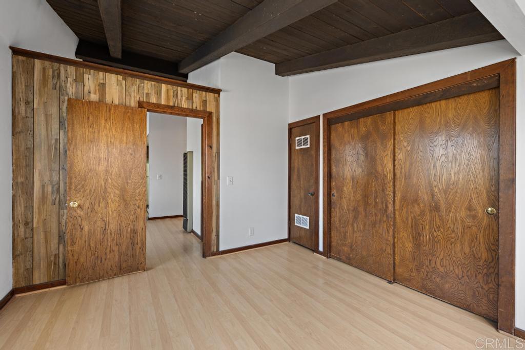 1048 Neptune Avenue Encinitas, CA 92024 - Photo 48 of 54 a view of empty room with wooden floor