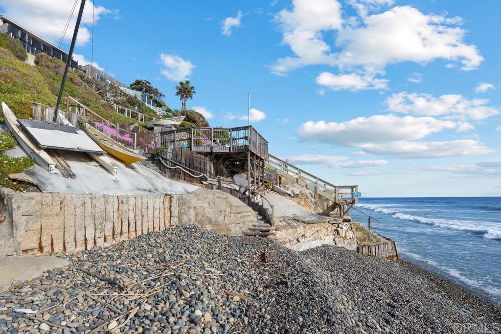 1048 Neptune Avenue Encinitas, CA 92024 - Photo 52 of 54 a view of a backyard with iron fence