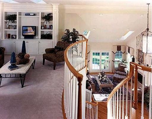 46 Regency Circle, Unit 31 Trumbull, CT 06611 - Photo 1 of 1 a living room with furniture a flat screen tv and a floor to ceiling window