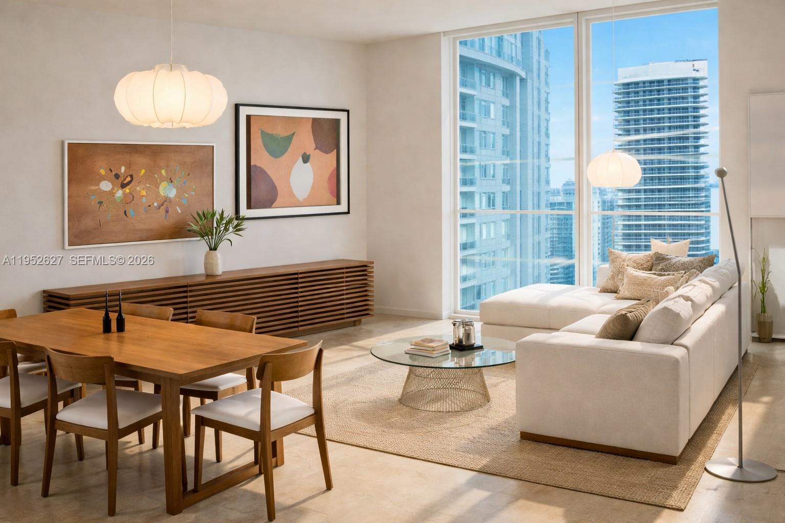 1060 Brickell Avenue, Unit 2013 Miami, FL 33131 - Photo 1 of 9 a dining room with furniture and a large window