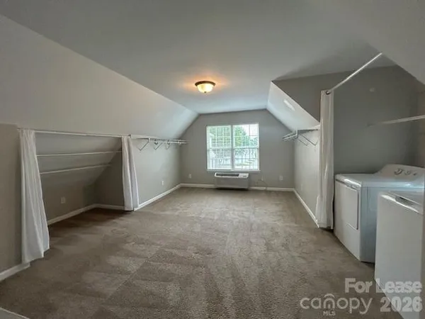 a view of a room that has a stove and a window