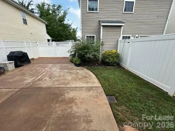 a kitchen that has a lot of cabinets and wooden floor