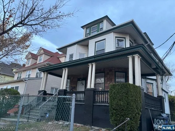 a front view of a house with glass windows