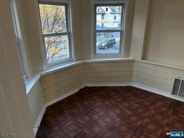a view of entryway with wooden floors