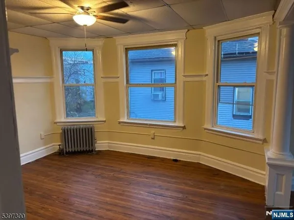 a view of front door with wooden floor