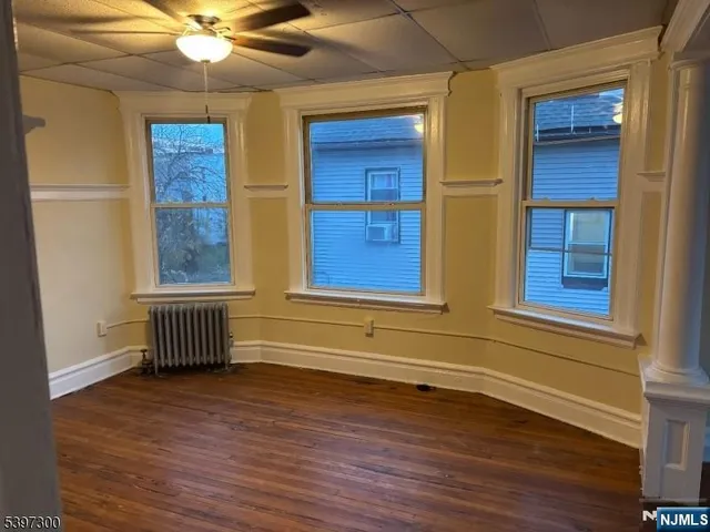 a view of front door with wooden floor