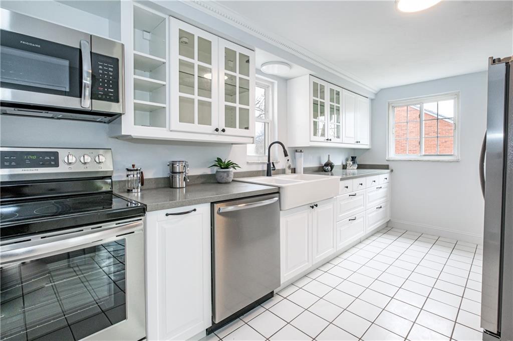4 Robinhood Road Pittsburgh, PA 15220 - Photo 12 of 25 a kitchen with stainless steel appliances granite countertop a sink and cabinets