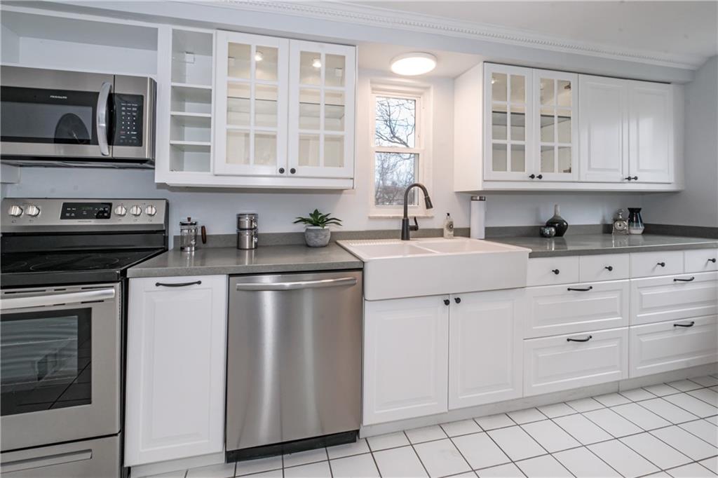 4 Robinhood Road Pittsburgh, PA 15220 - Photo 15 of 25 a kitchen with appliances a sink and cabinets