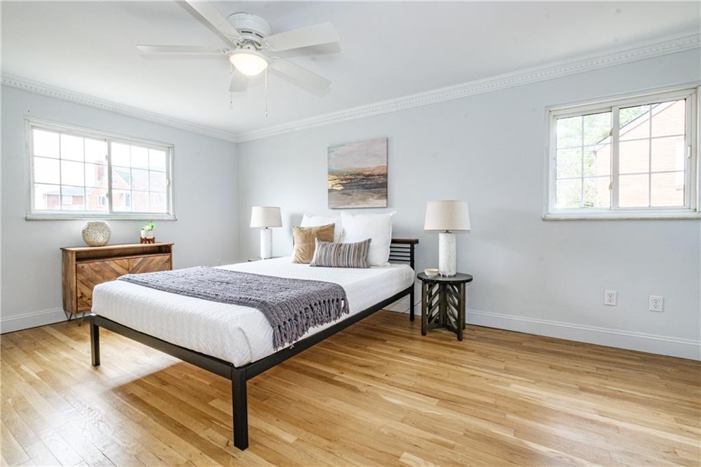 4 Robinhood Road Pittsburgh, PA 15220 - Photo 17 of 25 a bedroom with a bed and a table in it with window
