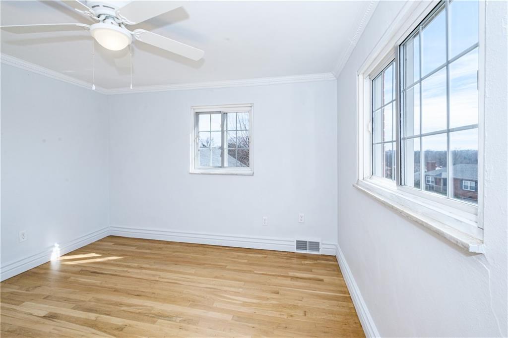 4 Robinhood Road Pittsburgh, PA 15220 - Photo 20 of 25 wooden floor in an empty room with a window