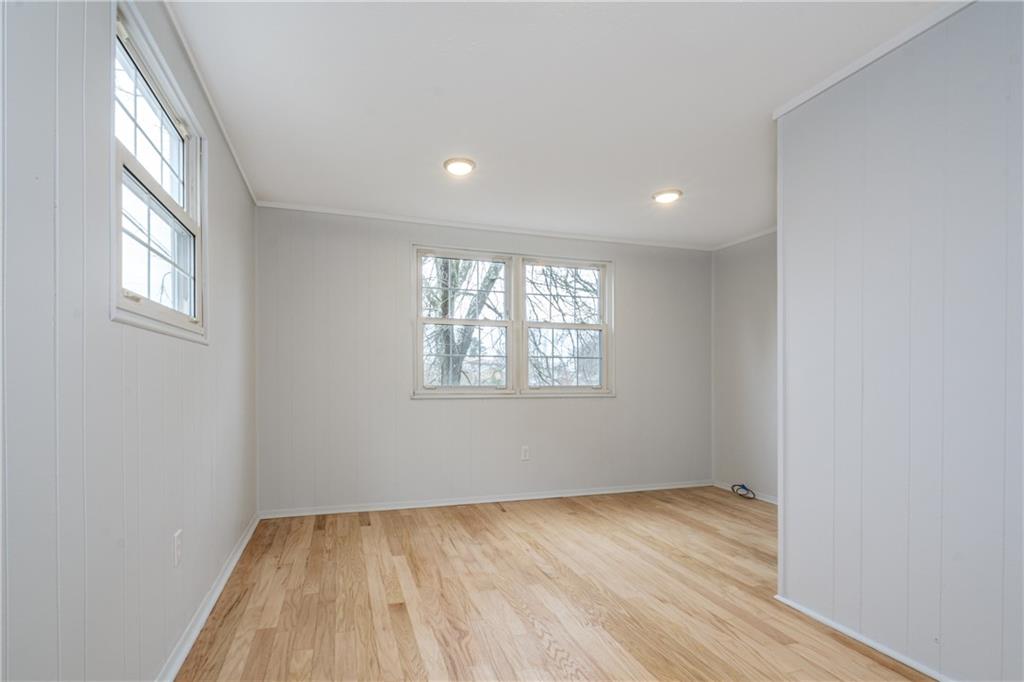 4 Robinhood Road Pittsburgh, PA 15220 - Photo 6 of 25 an empty room with wooden floor and windows