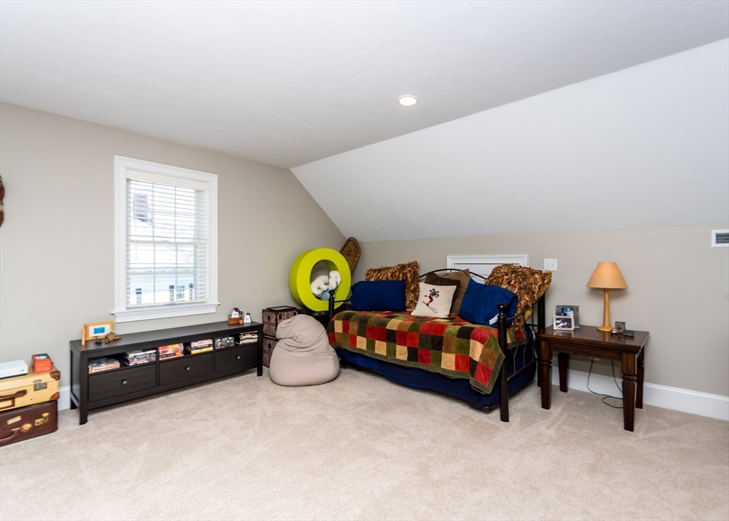 128 Church Street, Unit 2 Waltham, MA 02452 - Photo 32 of 41 a living room with furniture and a window
