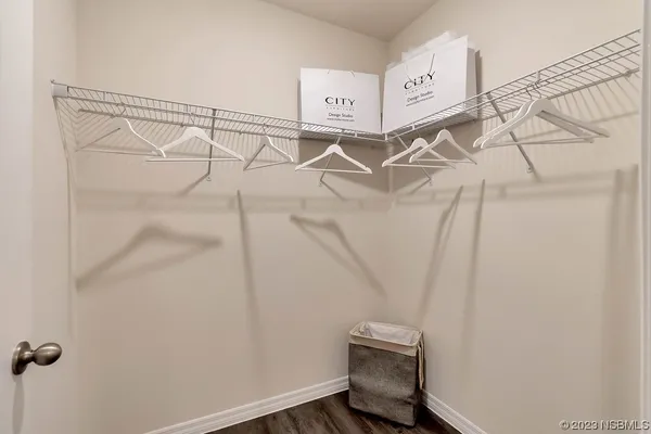 a bedroom with a bed and a desk