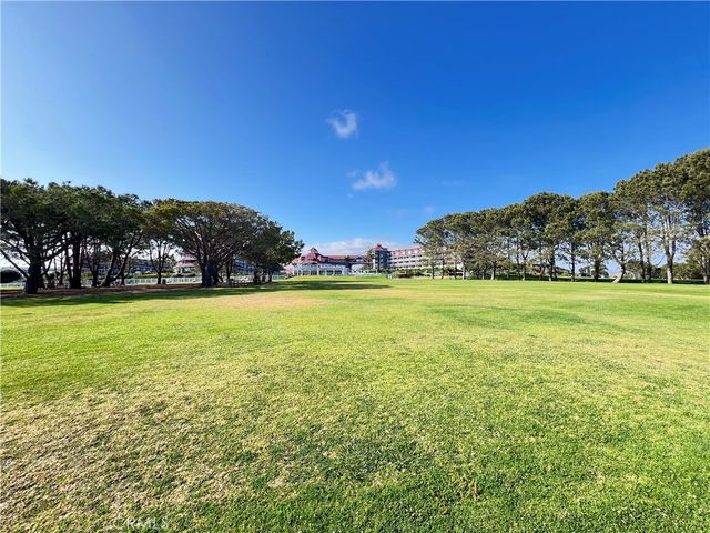a view of a field with an trees