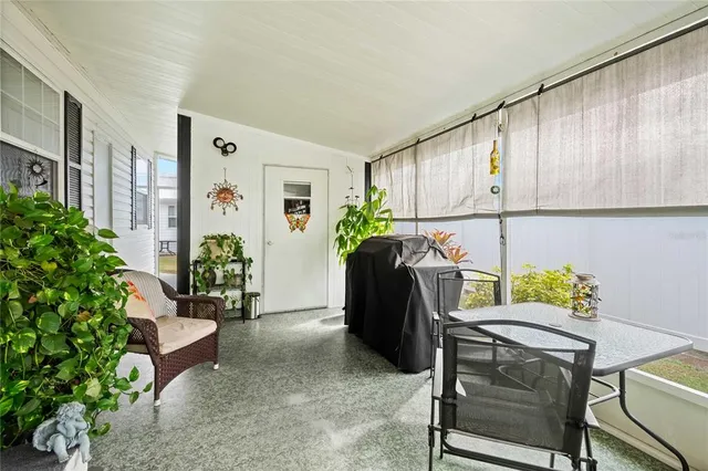 a front view of a house with a yard table and chairs