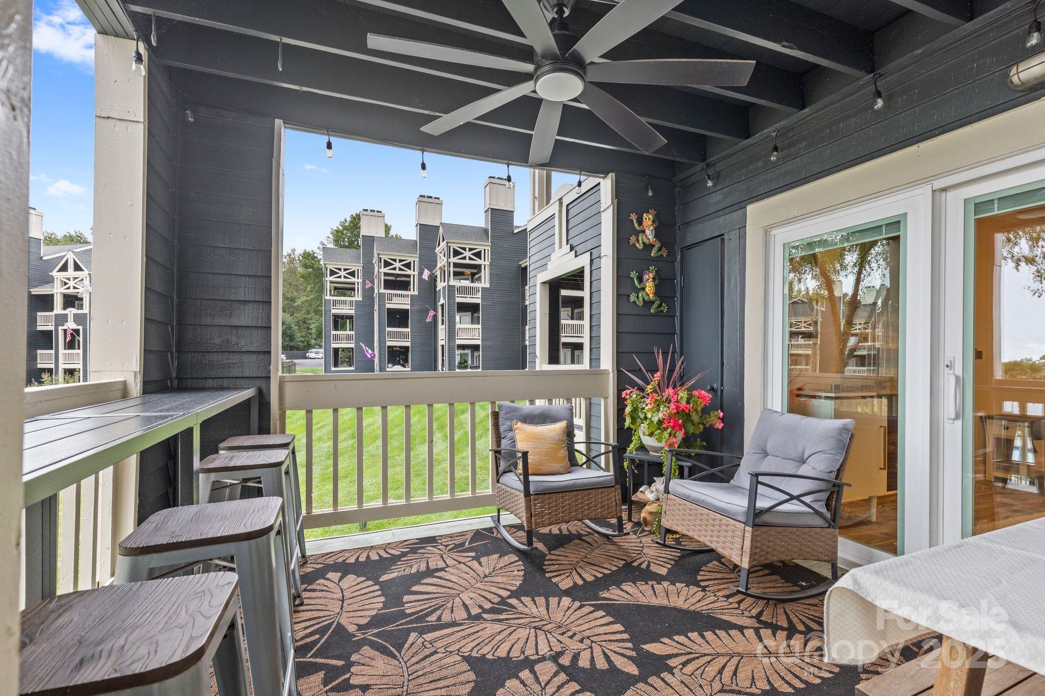 2121 Regatta Lane, Unit 209 Denver, NC 28037 - Photo 11 of 40 a living room with furniture and a window