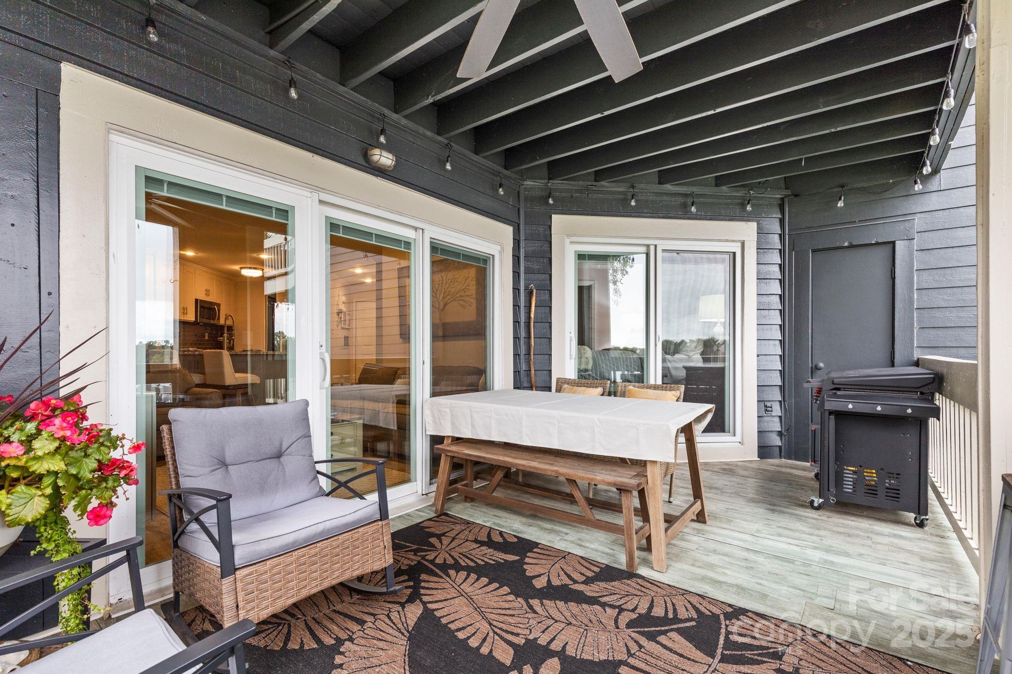 2121 Regatta Lane, Unit 209 Denver, NC 28037 - Photo 12 of 40 a living room with furniture and a fireplace