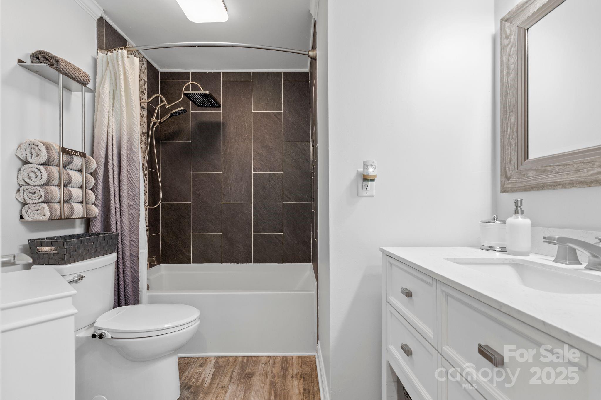 2121 Regatta Lane, Unit 209 Denver, NC 28037 - Photo 21 of 40 a bathroom with a sink toilet and shower