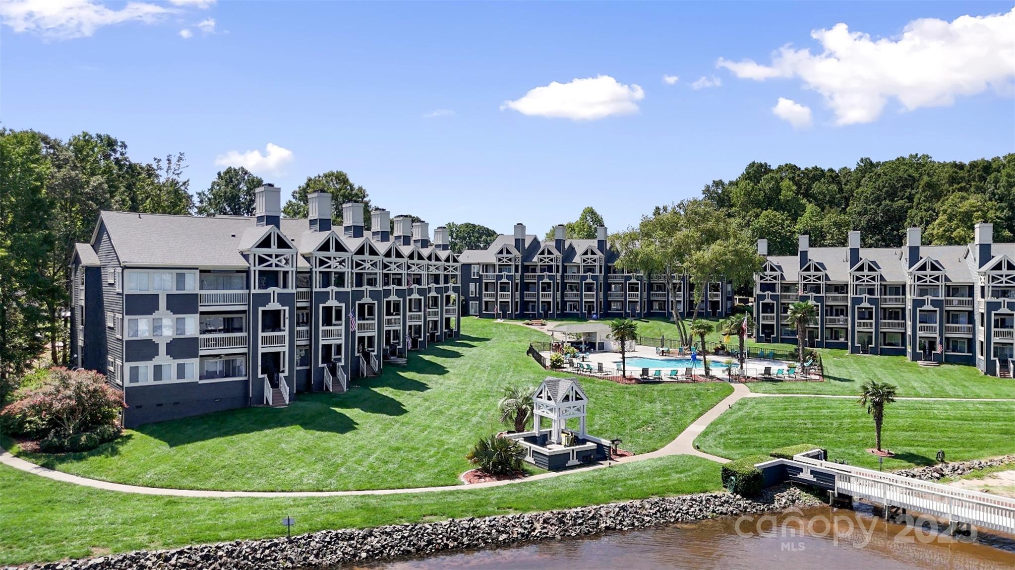 2121 Regatta Lane, Unit 209 Denver, NC 28037 - Photo 28 of 40 a view of a house with a big yard and a garden