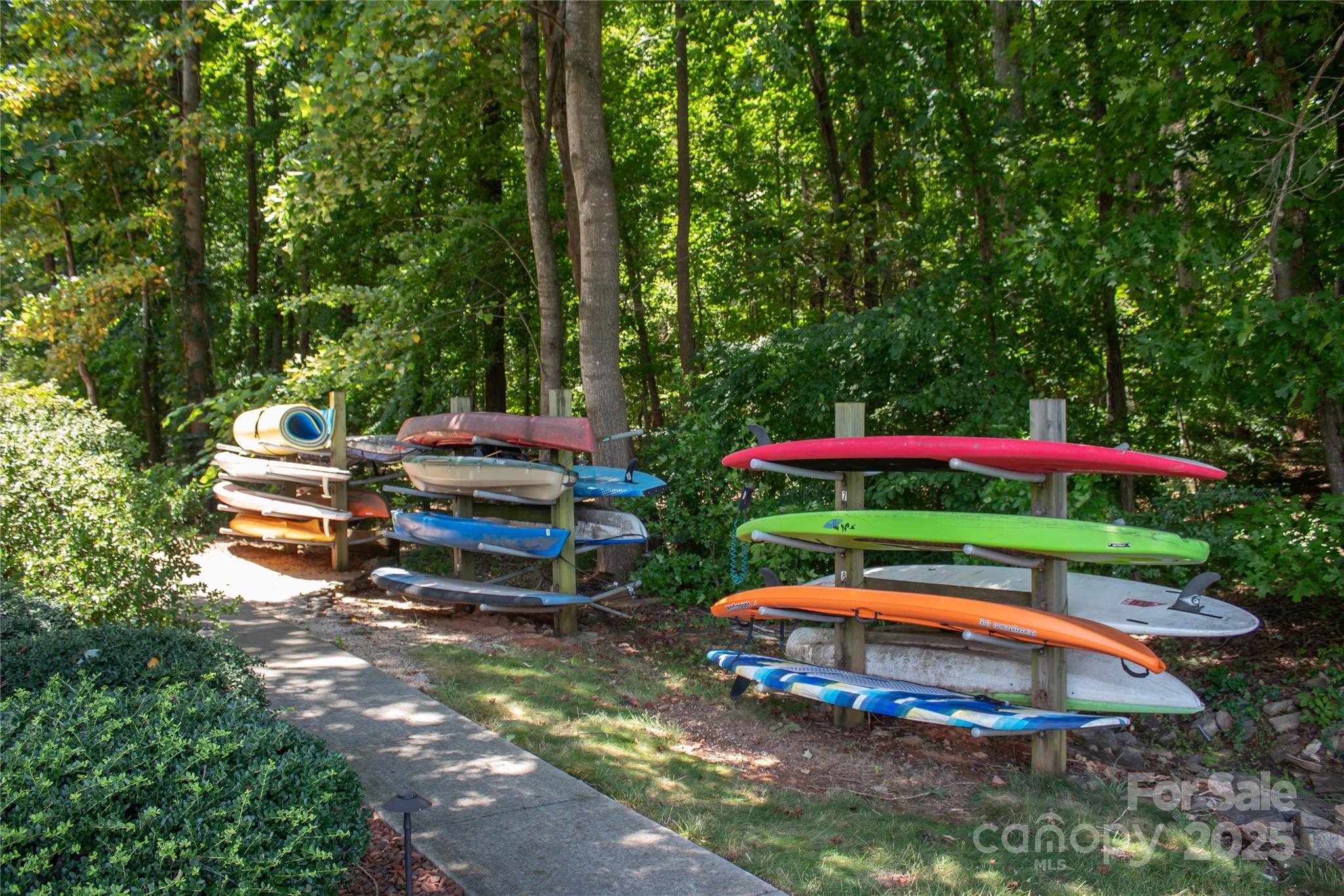 2121 Regatta Lane, Unit 209 Denver, NC 28037 - Photo 29 of 40 a backyard view with couple of cars parked