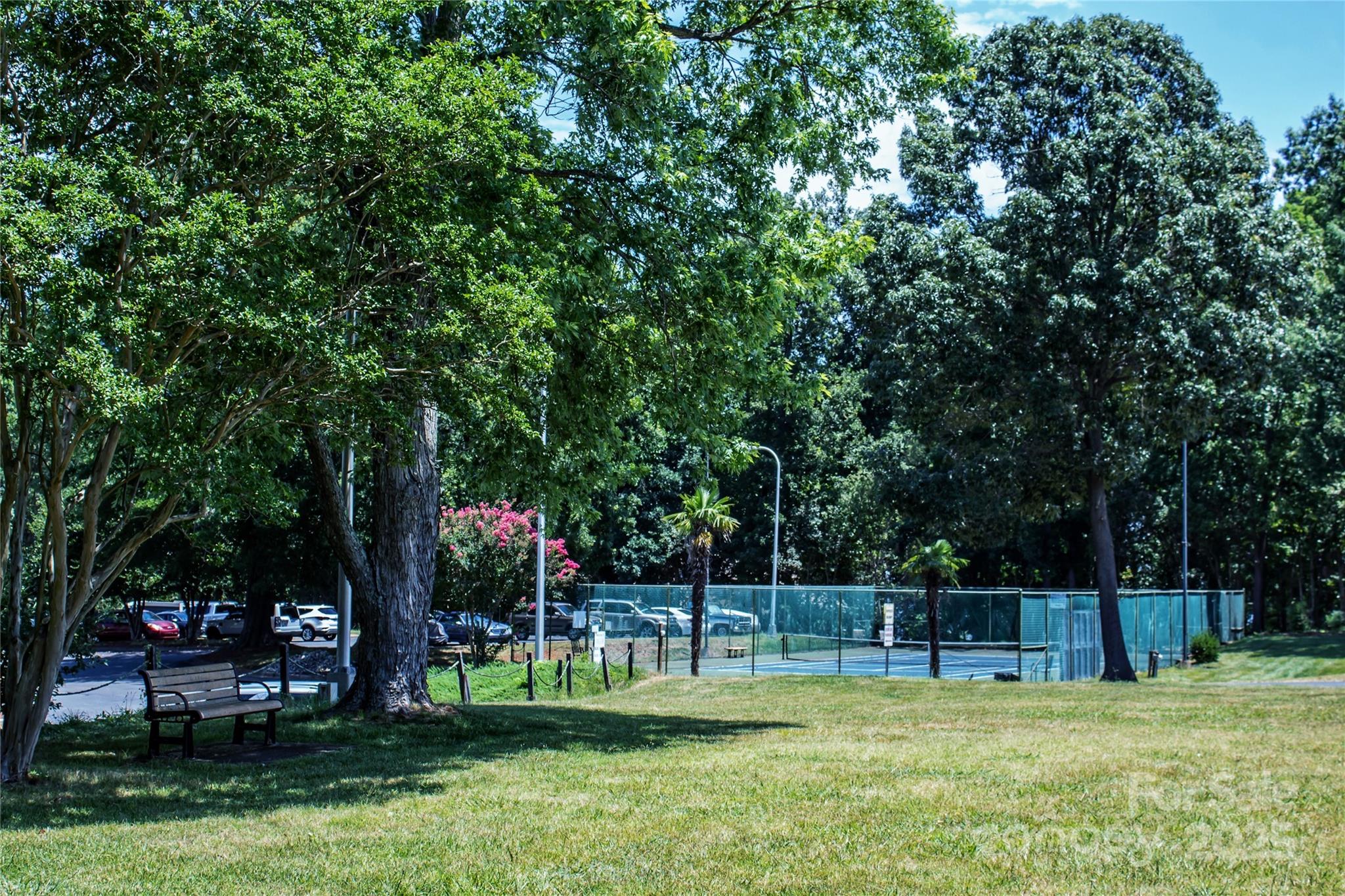 2121 Regatta Lane, Unit 209 Denver, NC 28037 - Photo 31 of 40 a view of a swimming pool with a bench