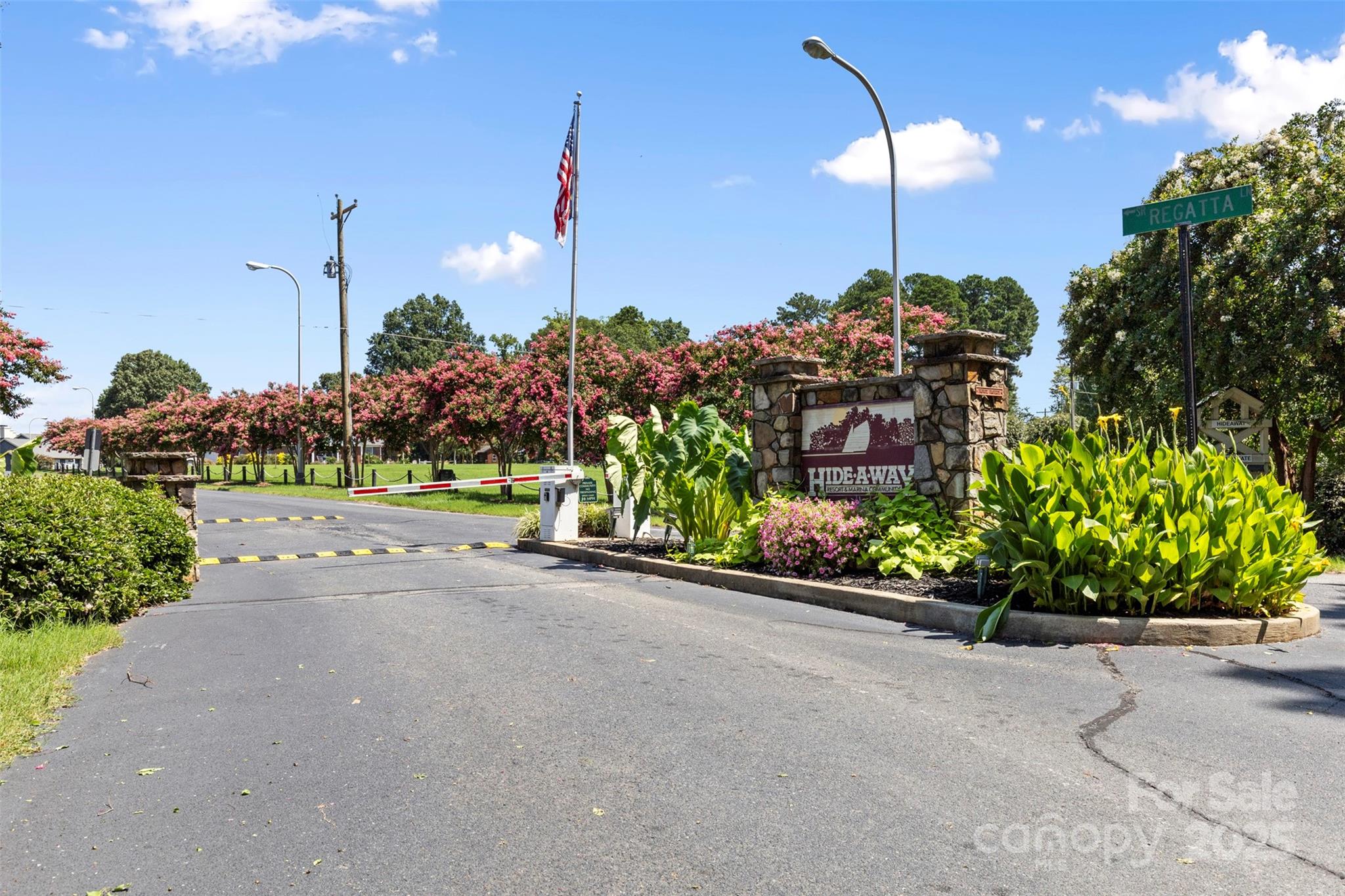 2121 Regatta Lane, Unit 209 Denver, NC 28037 - Photo 32 of 40 a view of a garden with a building in the background