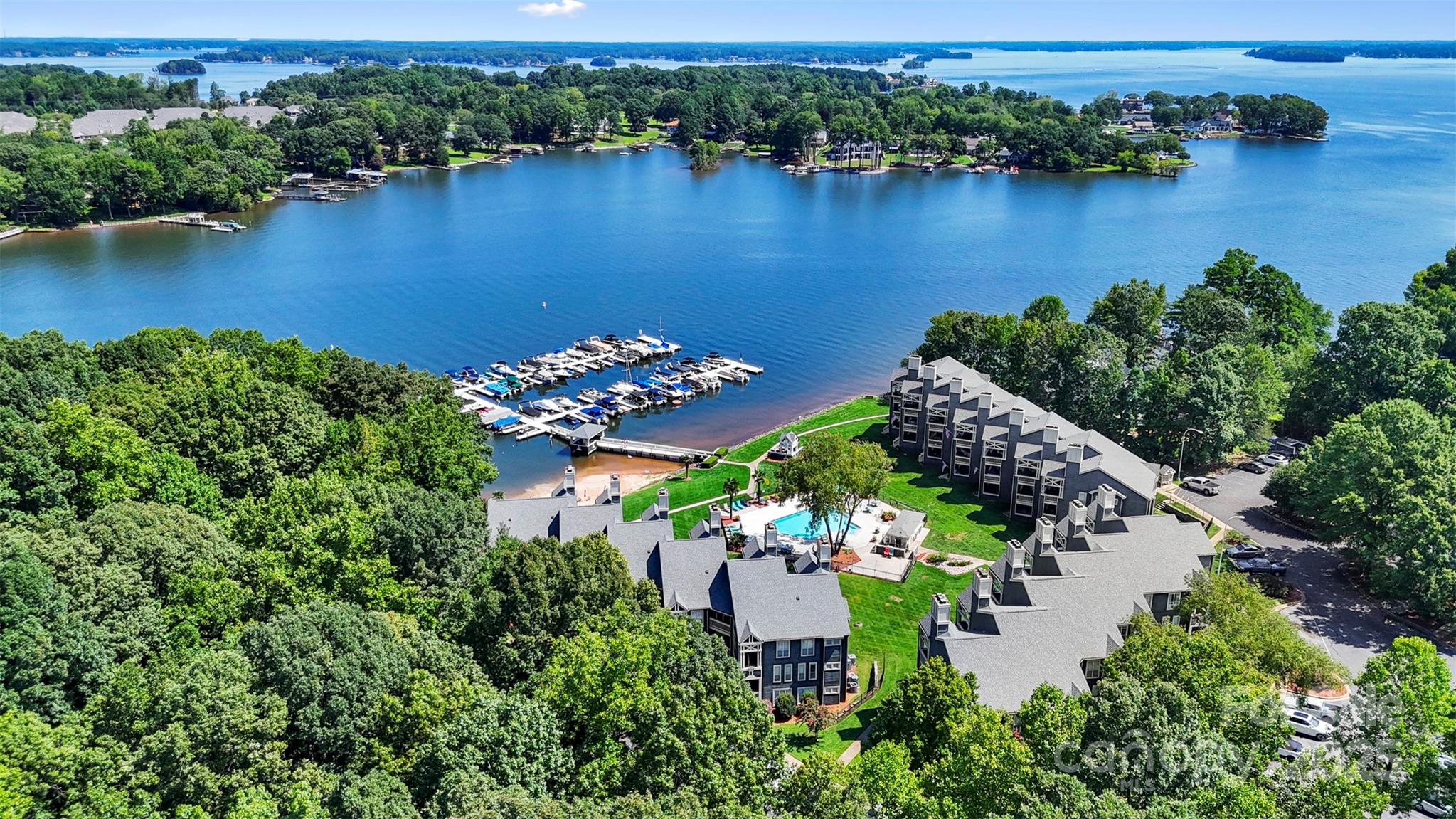 2121 Regatta Lane, Unit 209 Denver, NC 28037 - Photo 35 of 40 an aerial view of lake residential house with outdoor space and trees all around