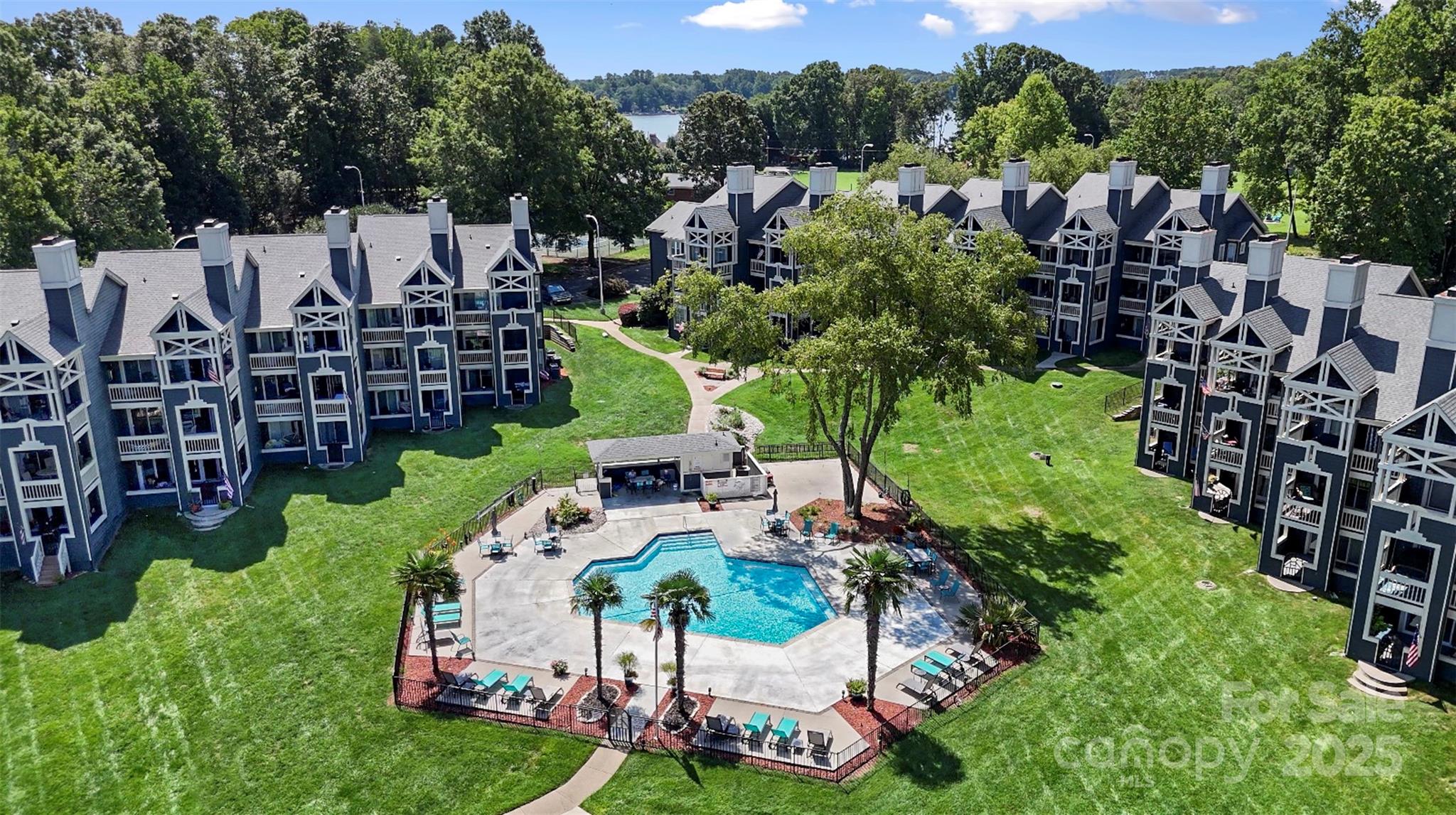2121 Regatta Lane, Unit 209 Denver, NC 28037 - Photo 36 of 40 a view of yard with swimming pool and outdoor seating