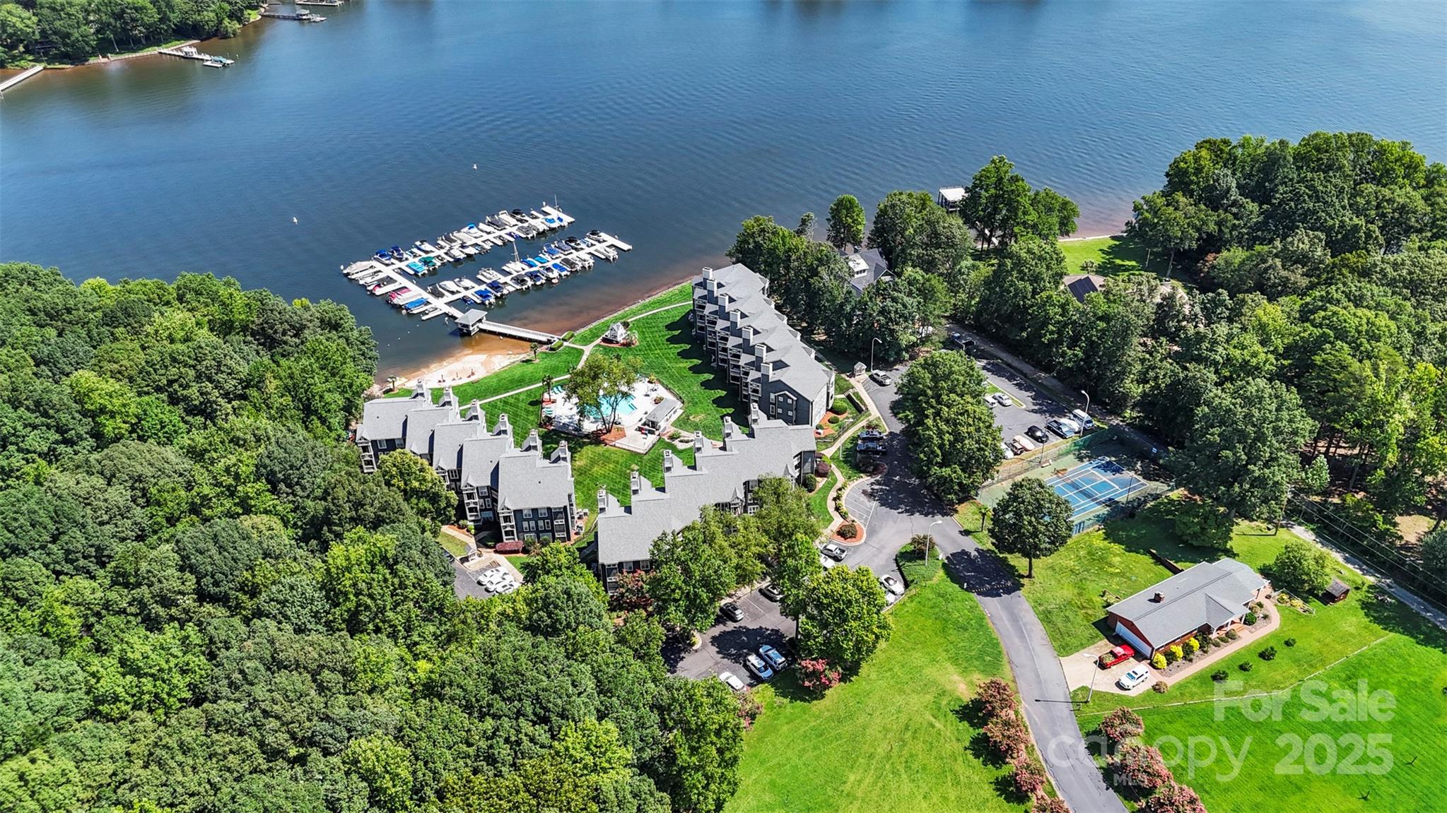 2121 Regatta Lane, Unit 209 Denver, NC 28037 - Photo 37 of 40 an aerial view of a house yard and swimming pool